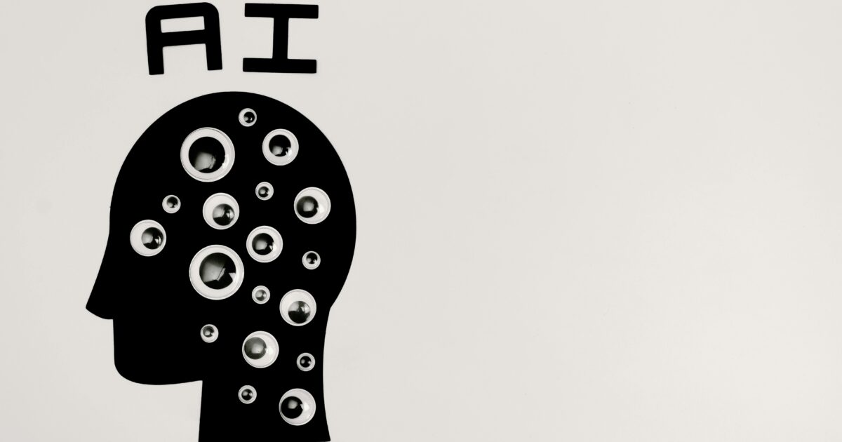 Silhouette image with "AI" written above